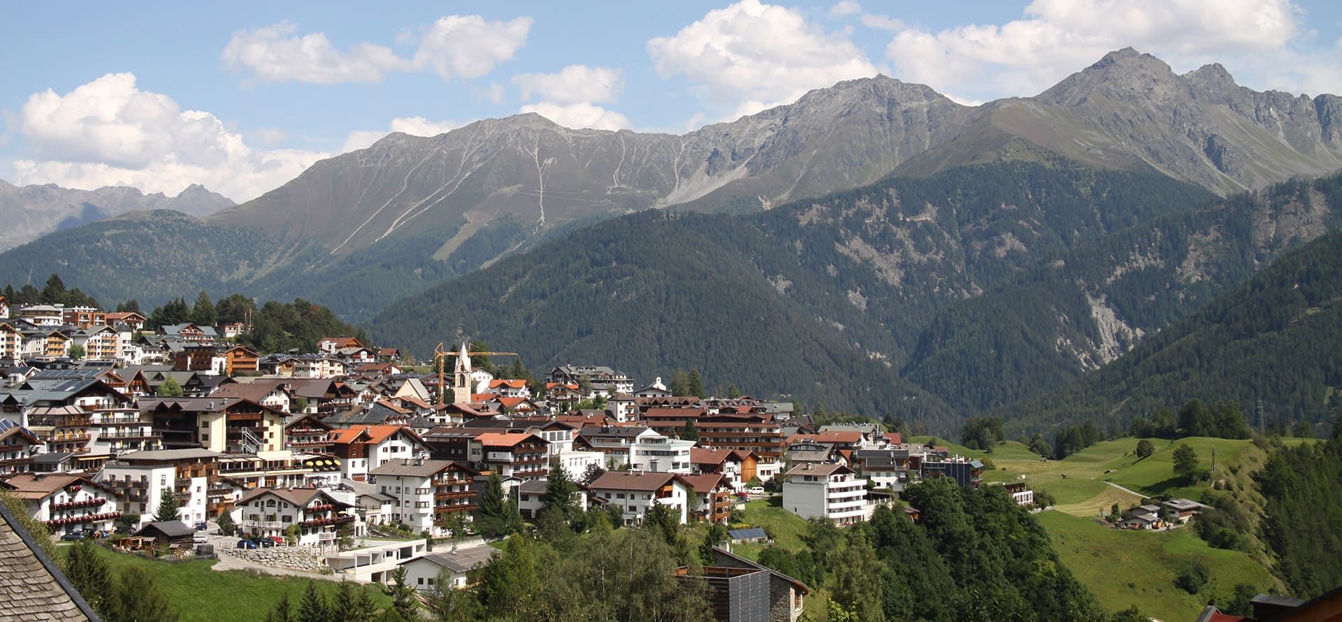 Serfaus town view with mountain panorama in summer
