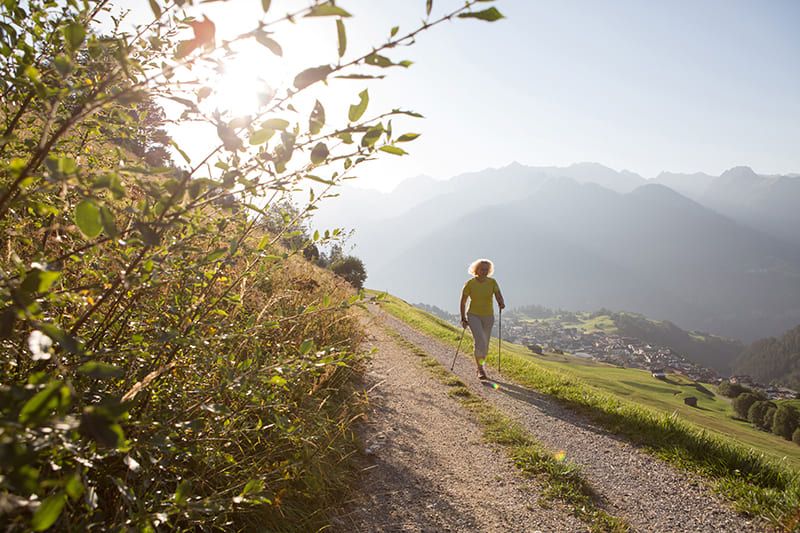 Nordic walking with a view of the village